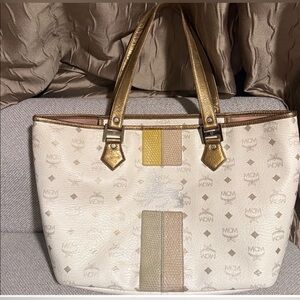 MCM Princess Lion Tote- Stain on interior lining and small cracking on outside.